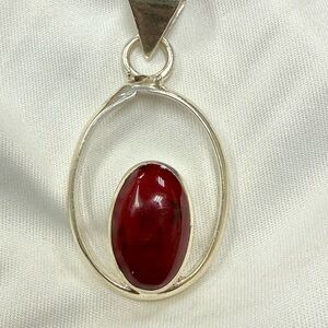 Elegant sterling silver pendant  with red  turquoise stone.